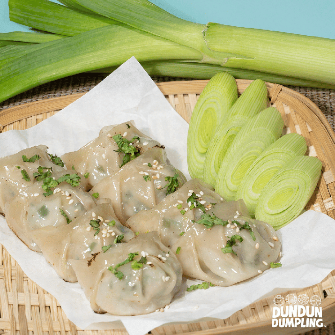pork w leeks dumpling. cooked dumpling. from side
