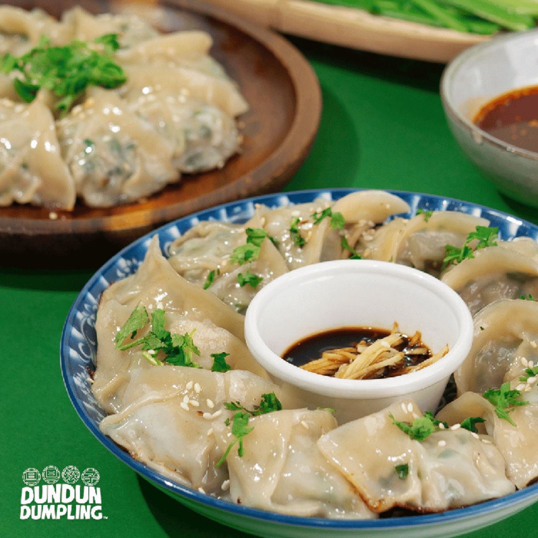 pork w chives dumpling. cooked dumpling. from side