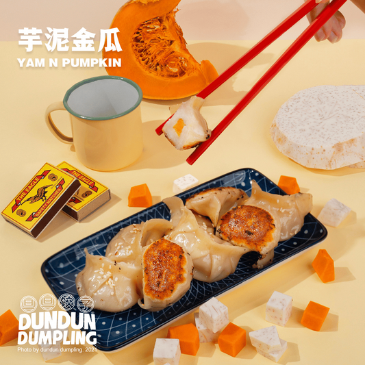 yam & pumpkin dumpling. cooked dumpling. cooked dumpling being picked up. from side