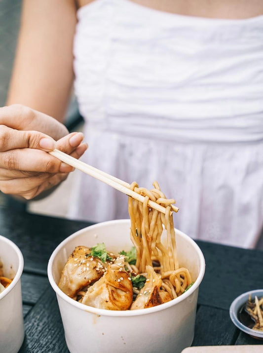 mala red oil noodle. cooked with dumpling. from side